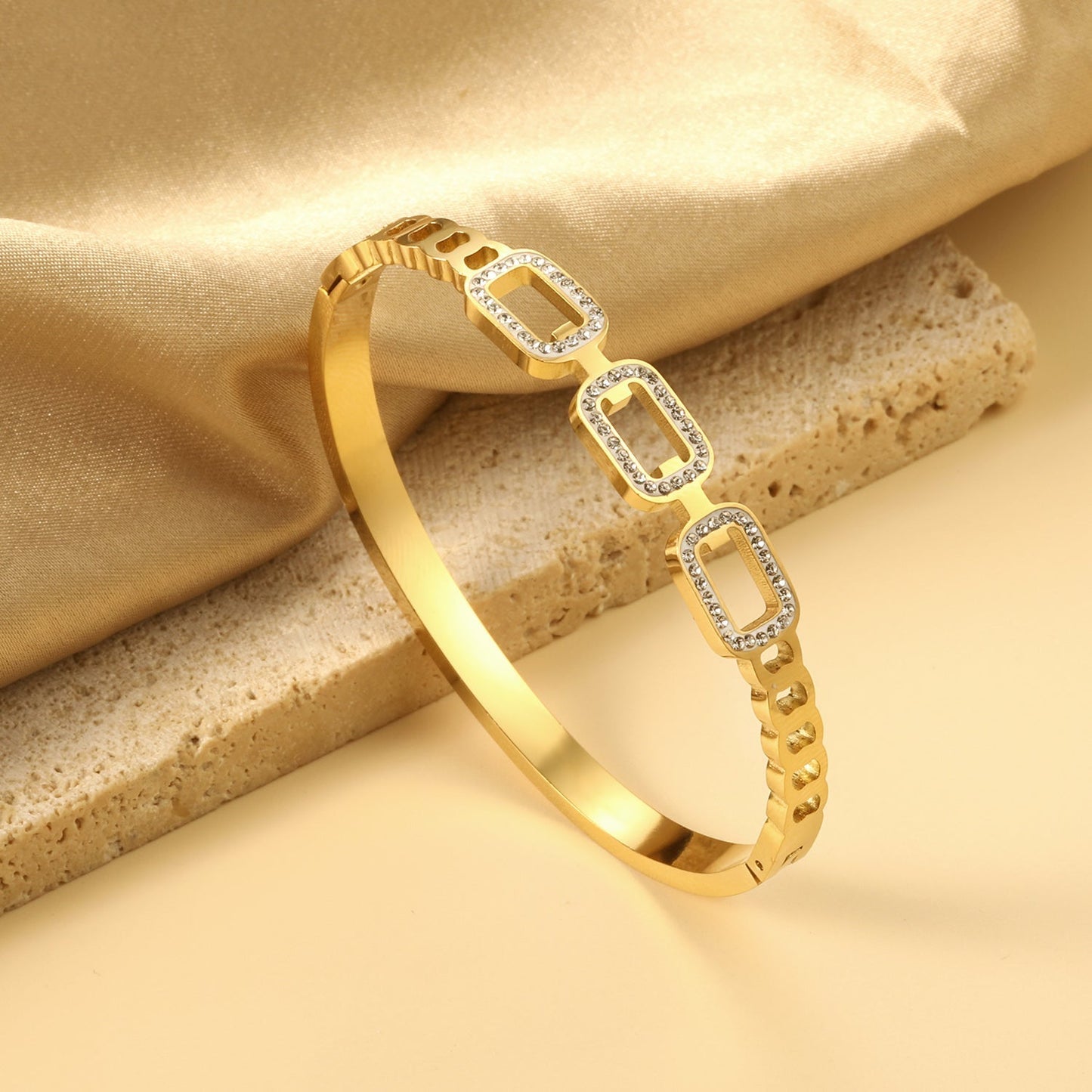 rigid square bracelet with three strands of small diamonds