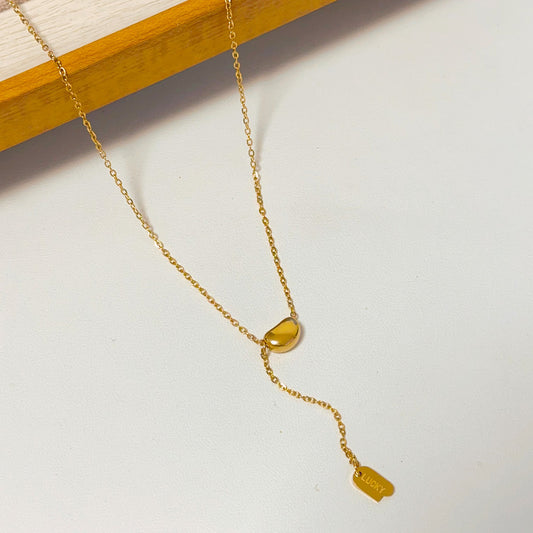 Bean pendant with charm