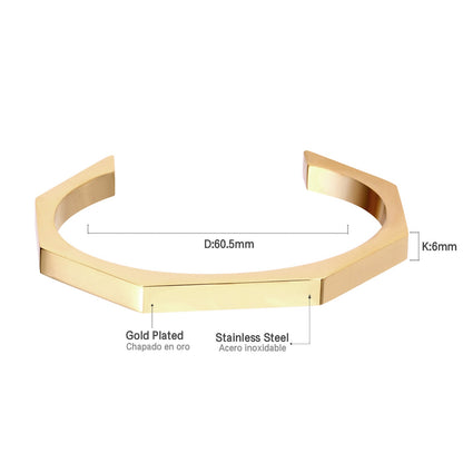 Gold-tone steel with an angular face on an open-end rigid bracelet.